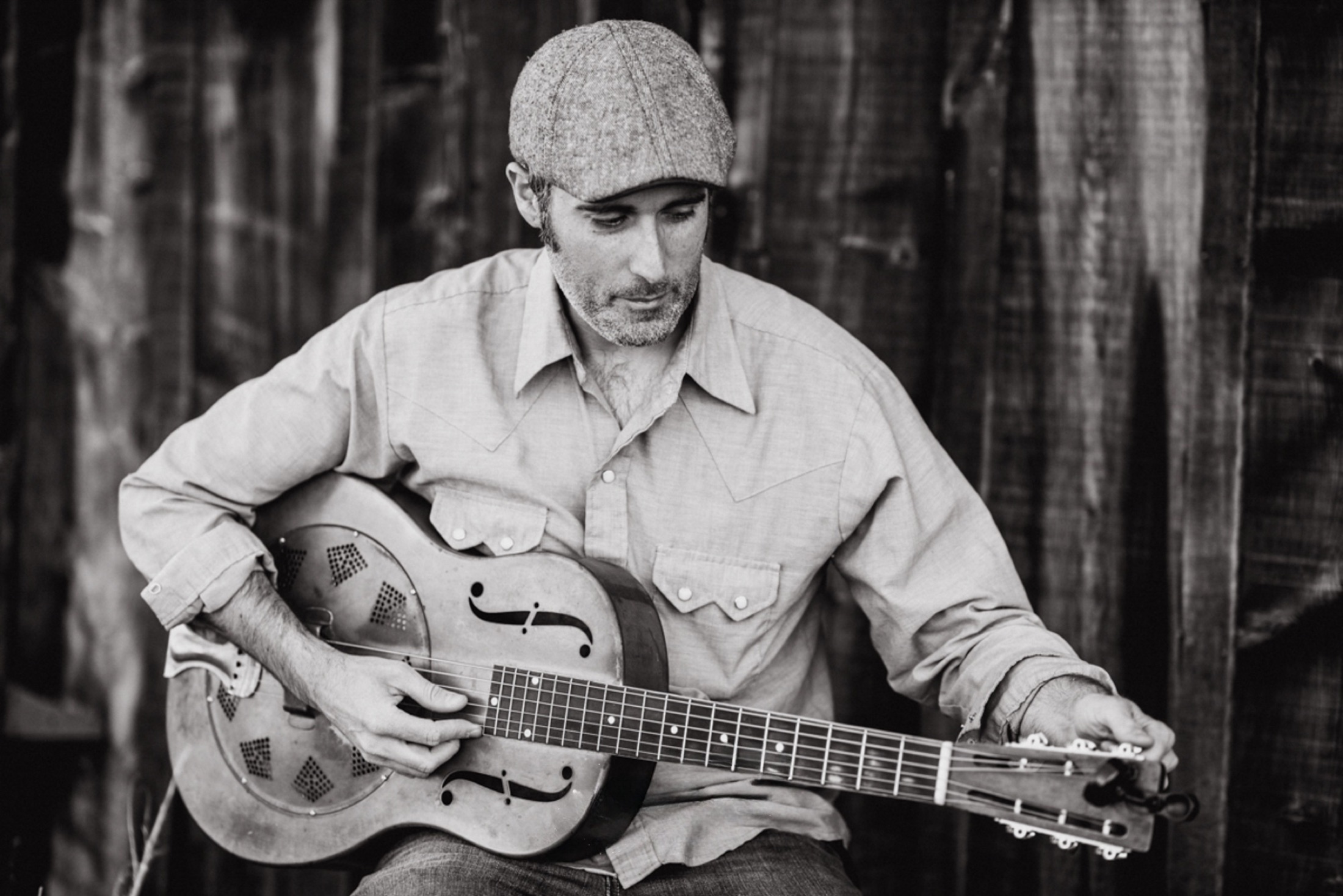 Steve Itterly playing a resonator guitar