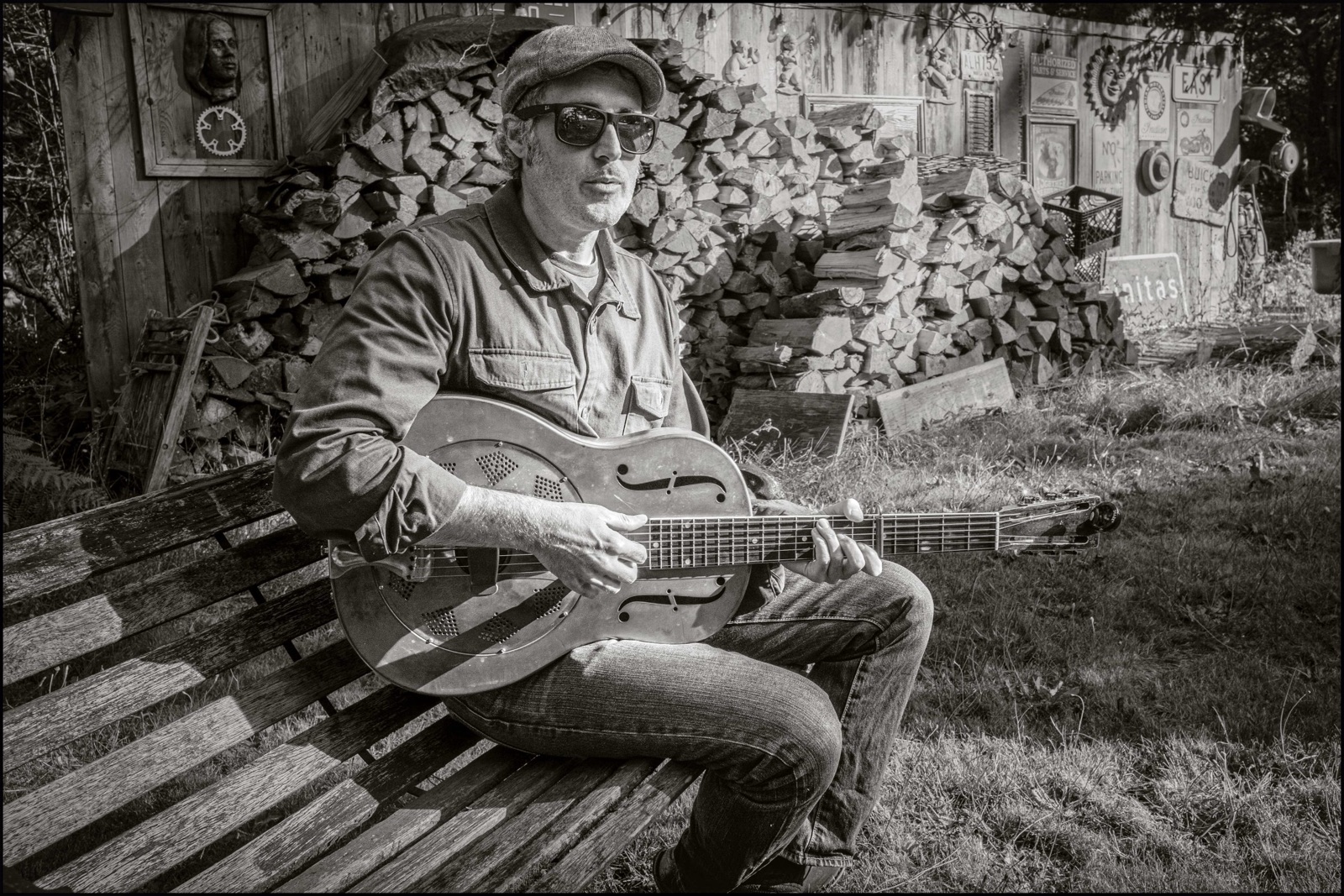 Steve Itterly seated with a resonator guitar